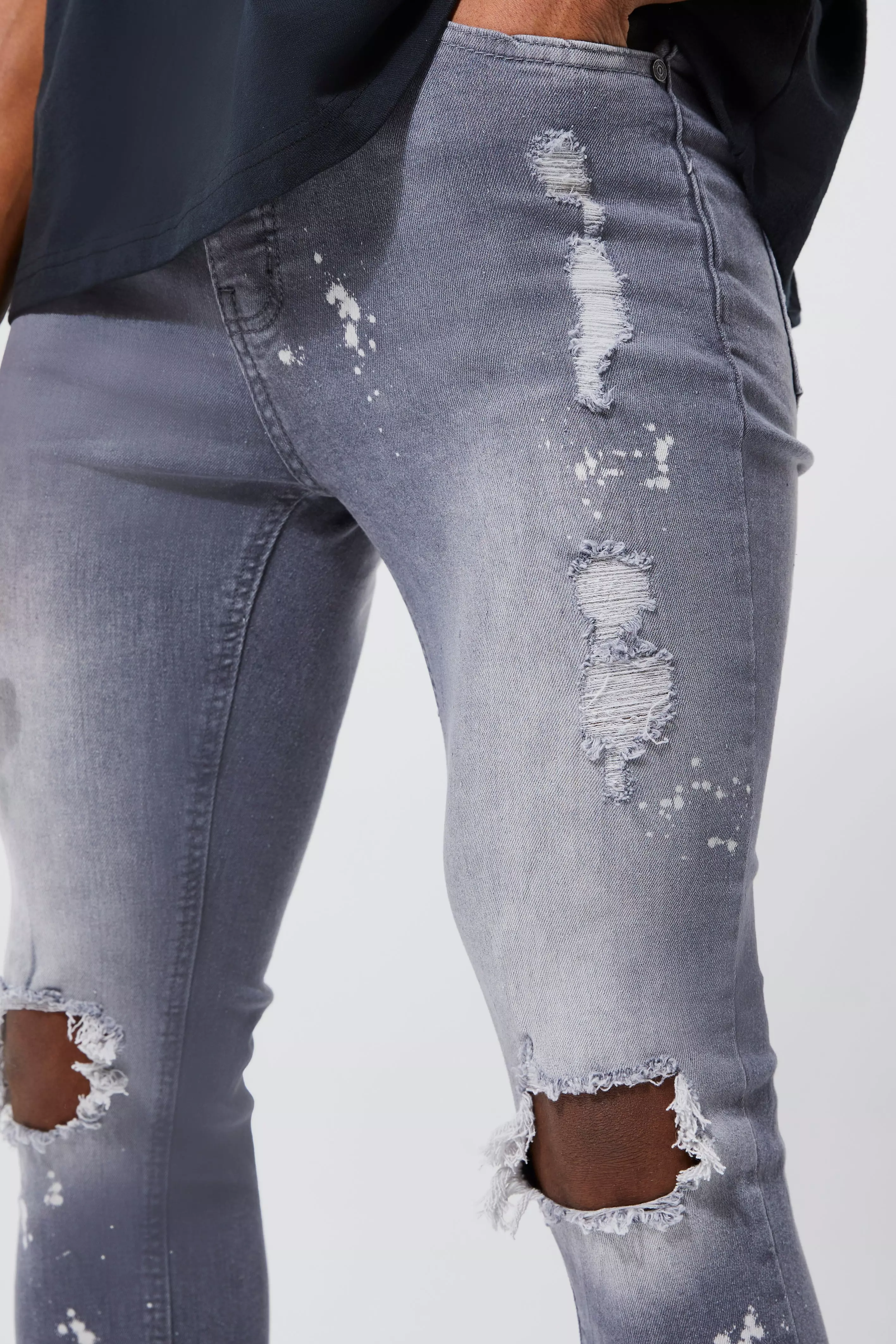 Skinny jeans with paint on sale splatters